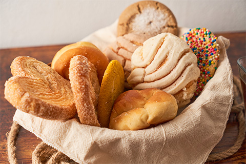 Different types of bread, like orejas, concha, among others.